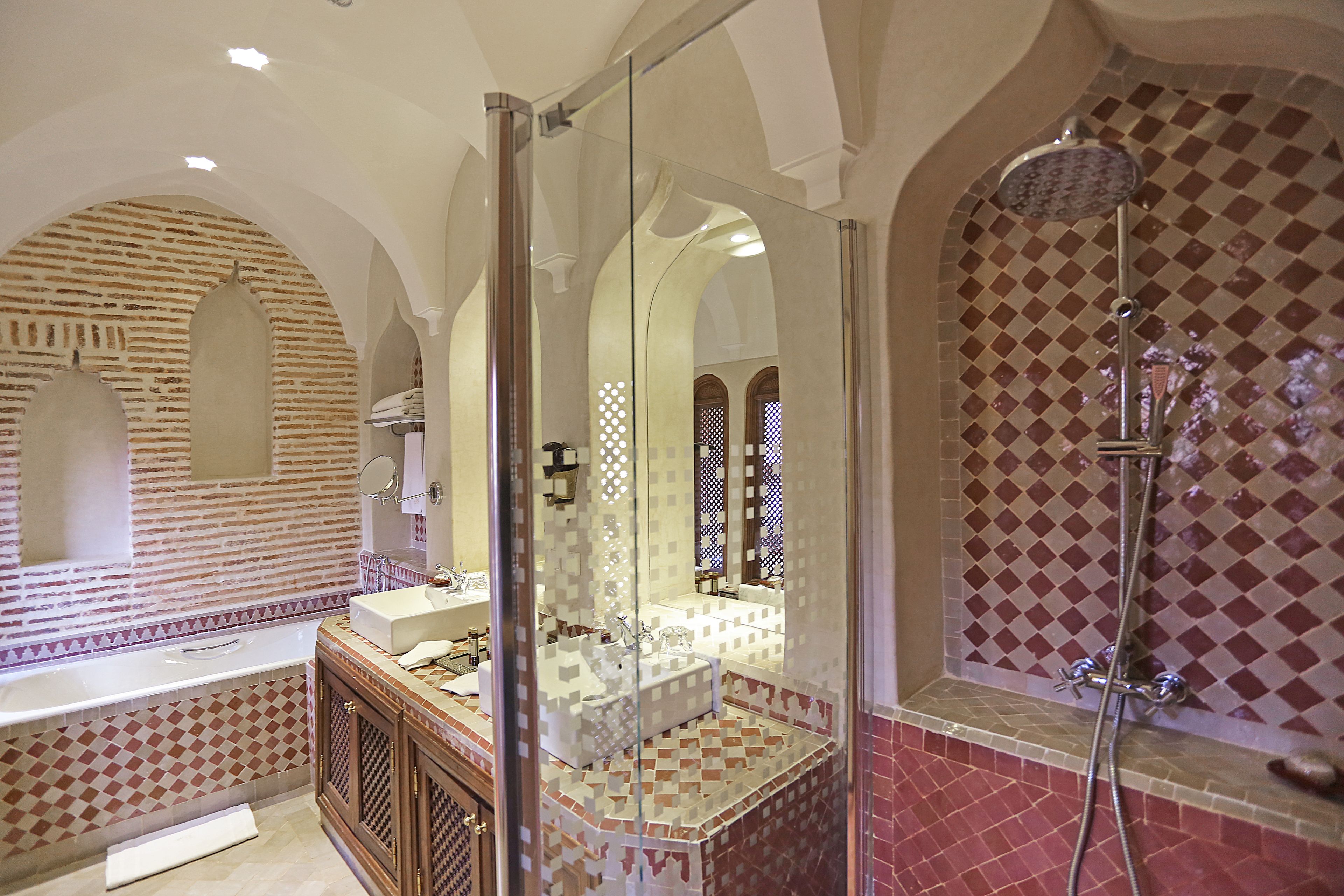 deluxe suite | bathroom | rainfall showerhead, free toiletries, hair dryer, bathrobes