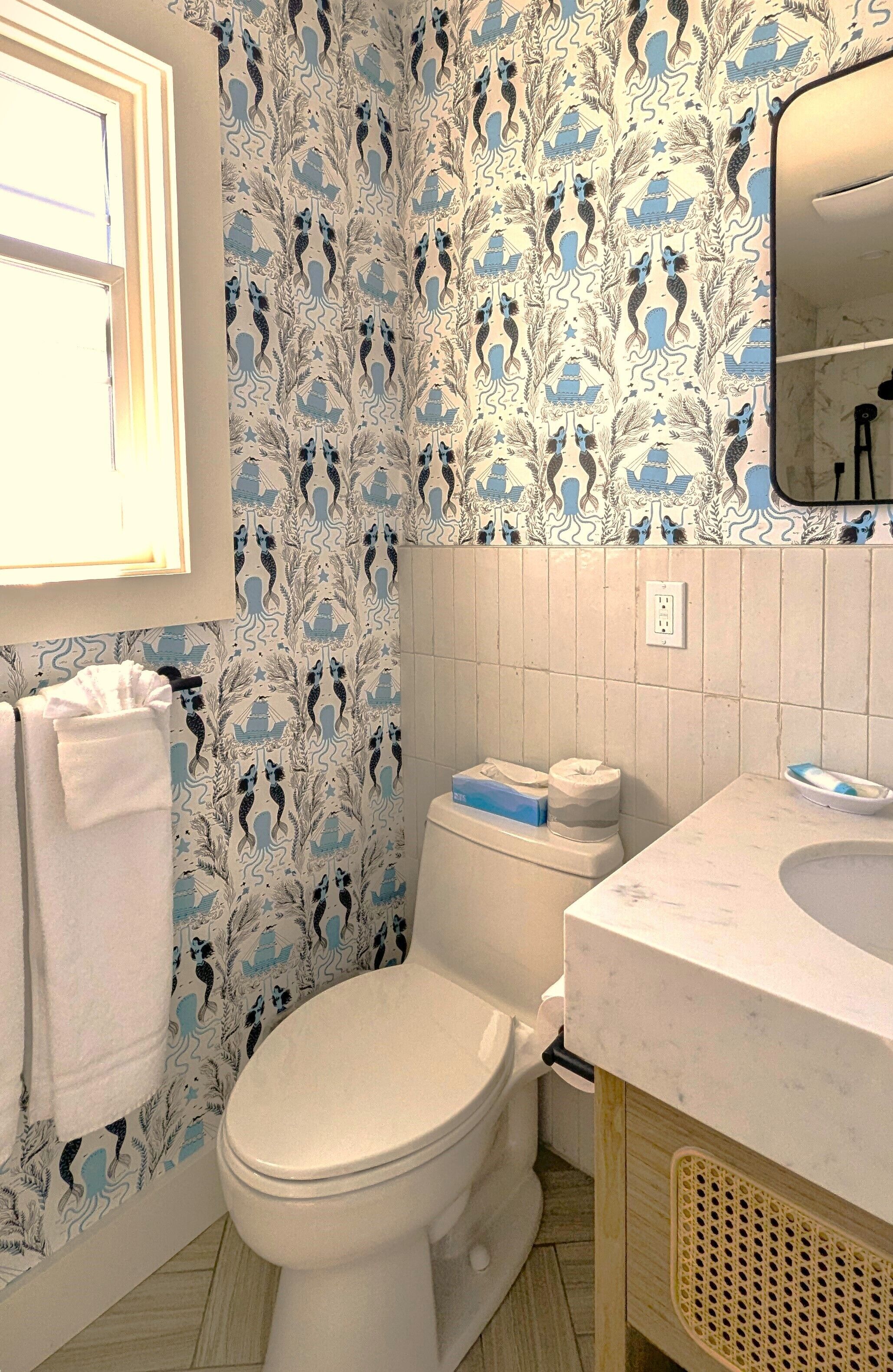 shower, hydromassage showerhead, hair dryer, towels