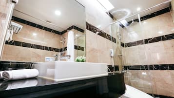 Junior Suite, 1 King Bed | Bathroom | Shower, hair dryer, bathrobes, slippers
