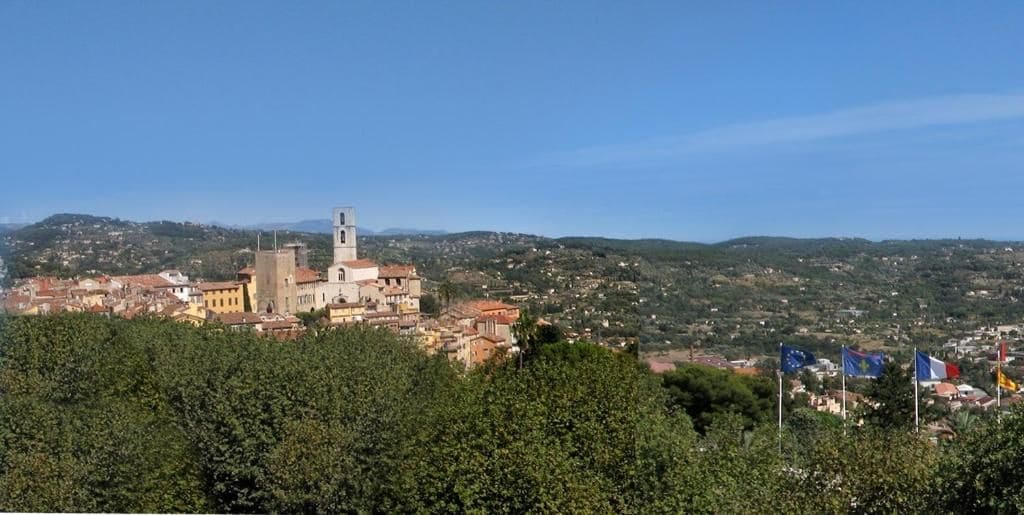 A town with a prominent church and a clear view of the surrounding landscape.