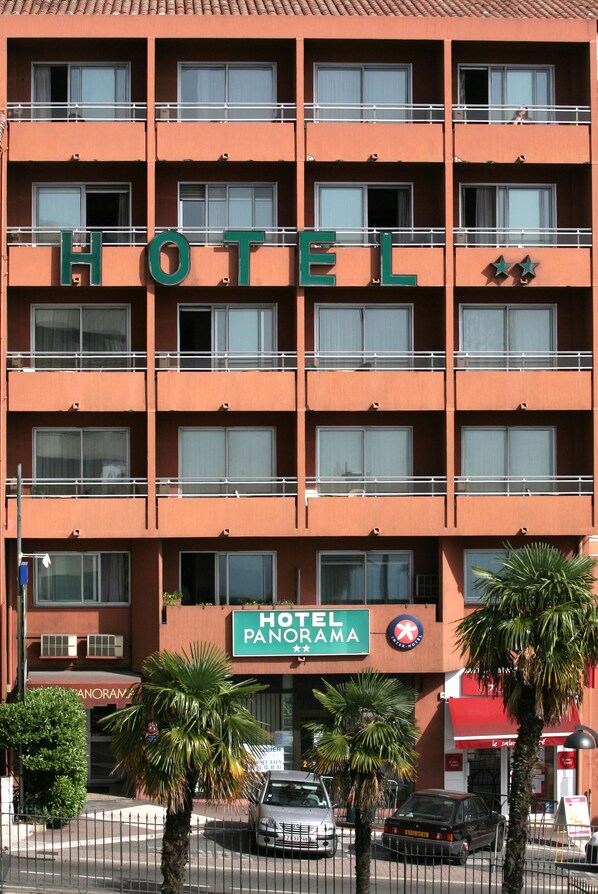 Exterior of Hotel Panorama in Grasse, France, with a beautiful garden and stunning views