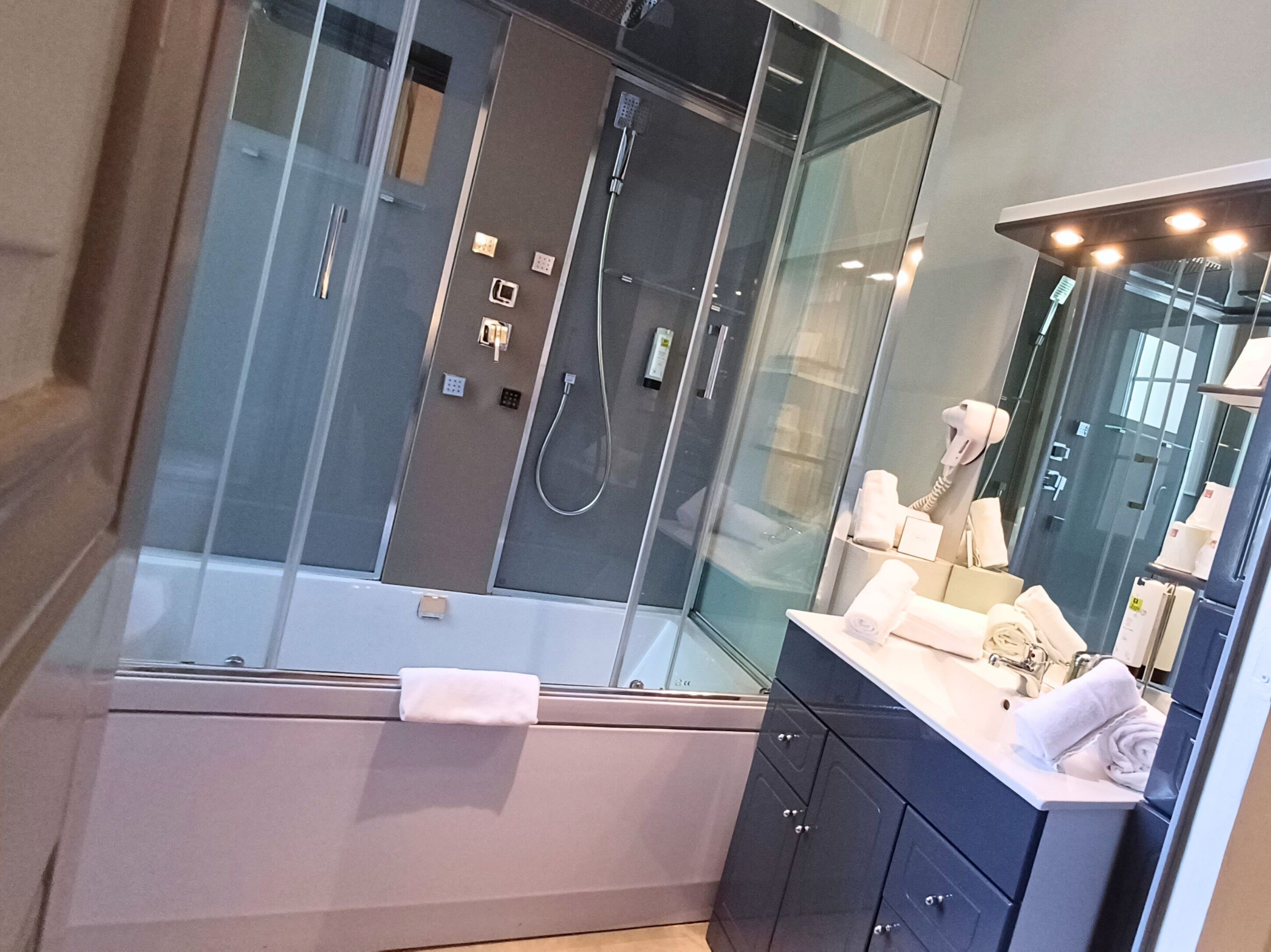 traditional suite | bathroom | hair dryer, towels