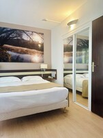 Junior Suite, Balcony, Garden View | Minibar, in-room safe, desk, free cribs/infant beds
