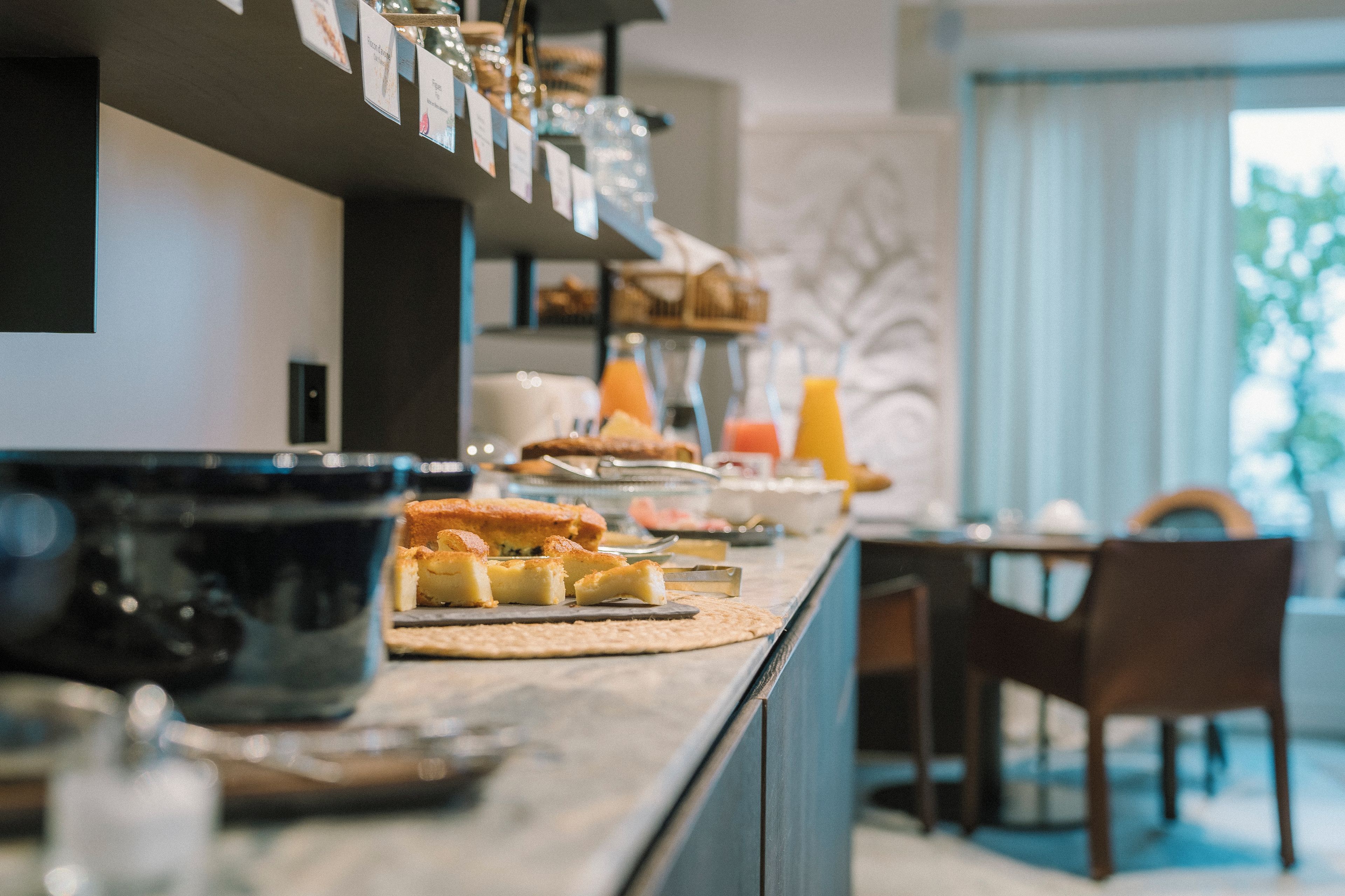 A breakfast buffet with various food items and beverages.