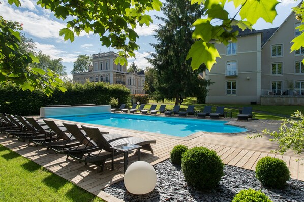 Outdoor pool, open 10:00 AM to 9:00 PM, pool loungers