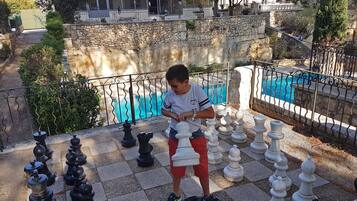 Guests can enjoy a game of chess in the outdoor courtyard.