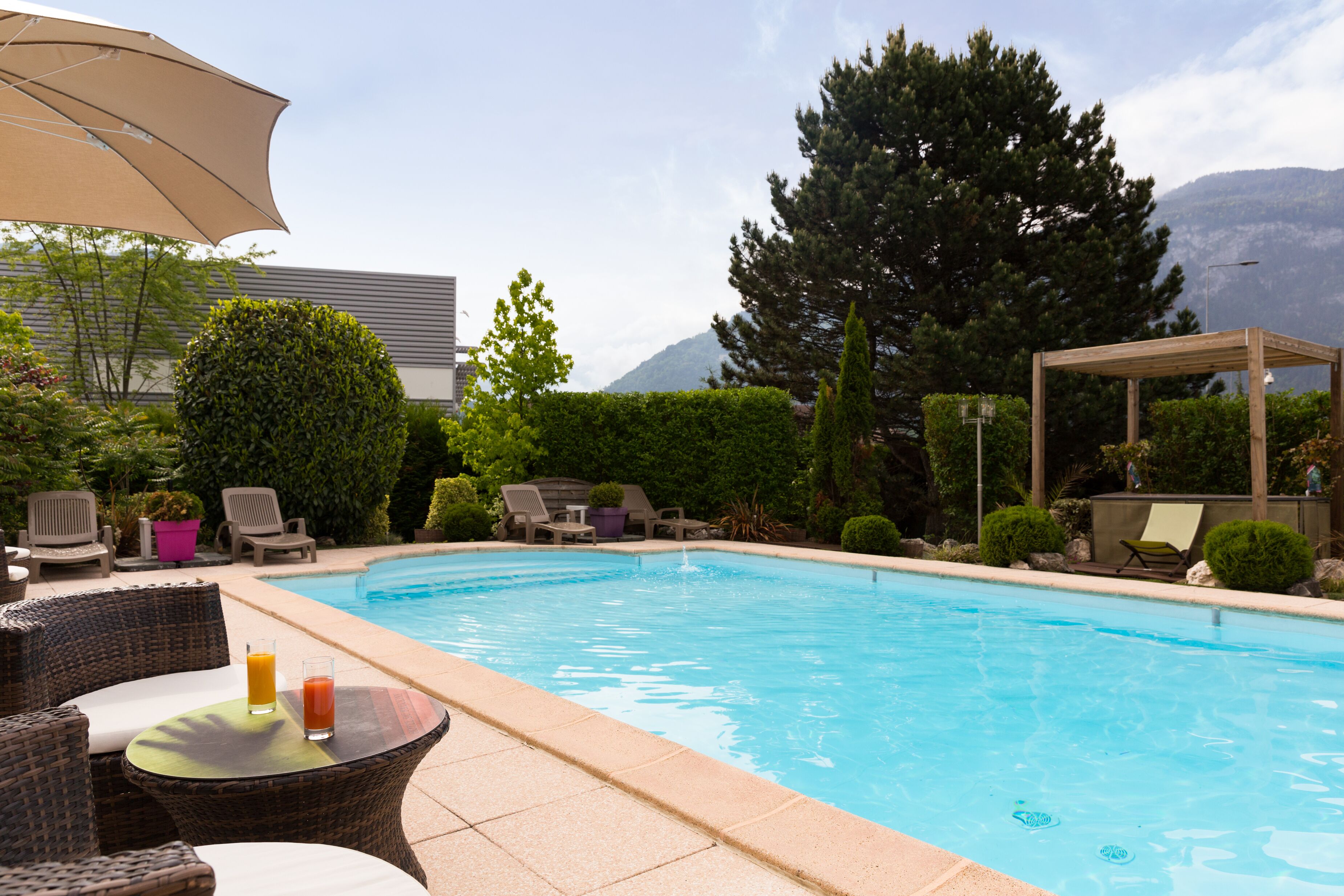 outdoor pool, pool umbrellas, pool loungers