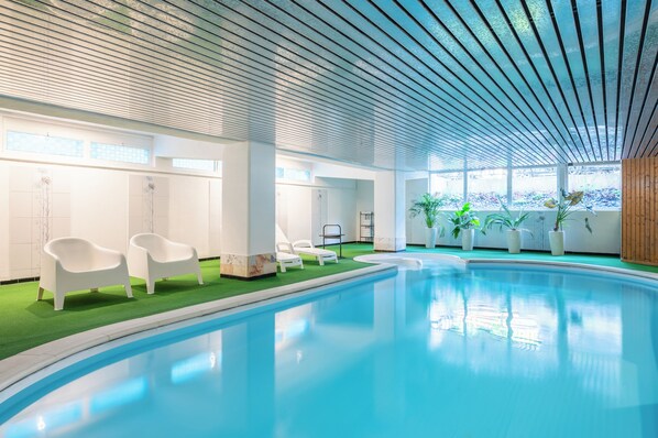 Indoor pool, open 7:30 AM to 9:00 PM, pool loungers