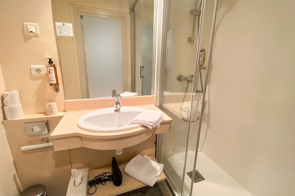 classic room, 1 single bed, non smoking | bathroom | free toiletries, hair dryer, towels, soap