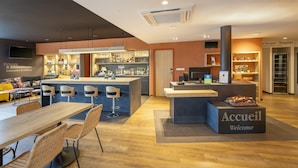 A modern interior with a bar area, seating, and a reception desk. - Sure Hotel by Best Western Dole (Dole)