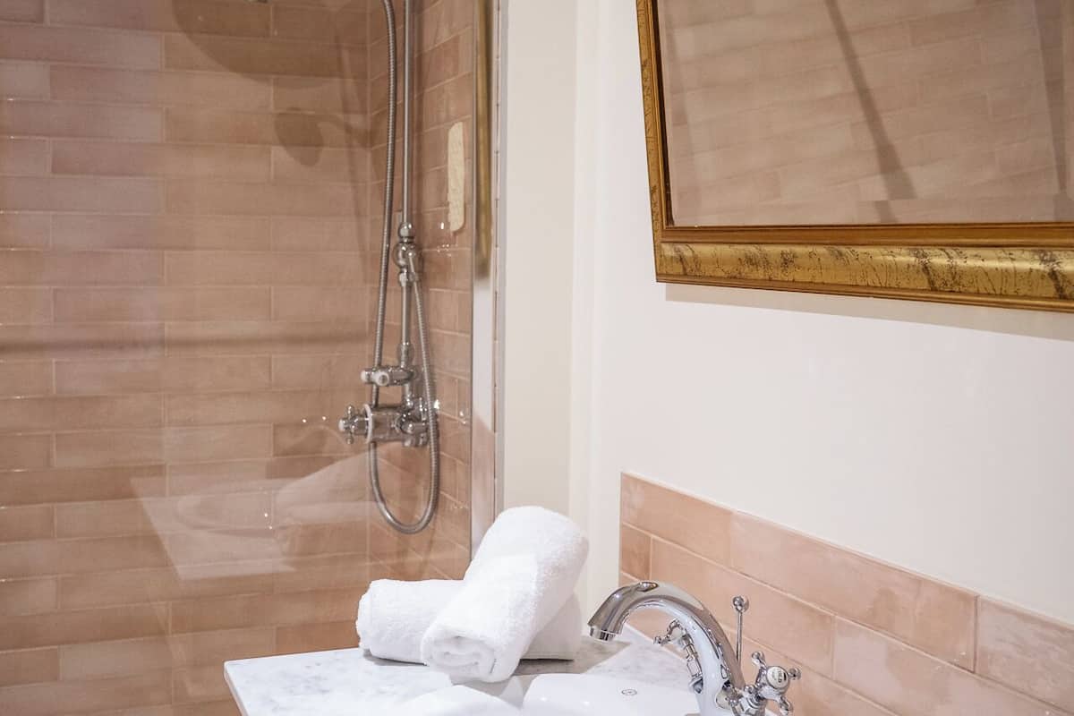 superior triple room | bathroom | hair dryer, towels, soap, shampoo