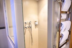 Junior Suite, 1 Bedroom, City View | Bathroom | Hair dryer, bathrobes, slippers, towels
