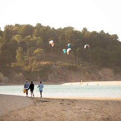 On the beach, white sand, sun loungers, beach towels