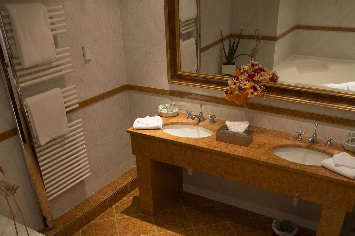 luxury suite (duplex) | bathroom | hair dryer, bathrobes, slippers, towels