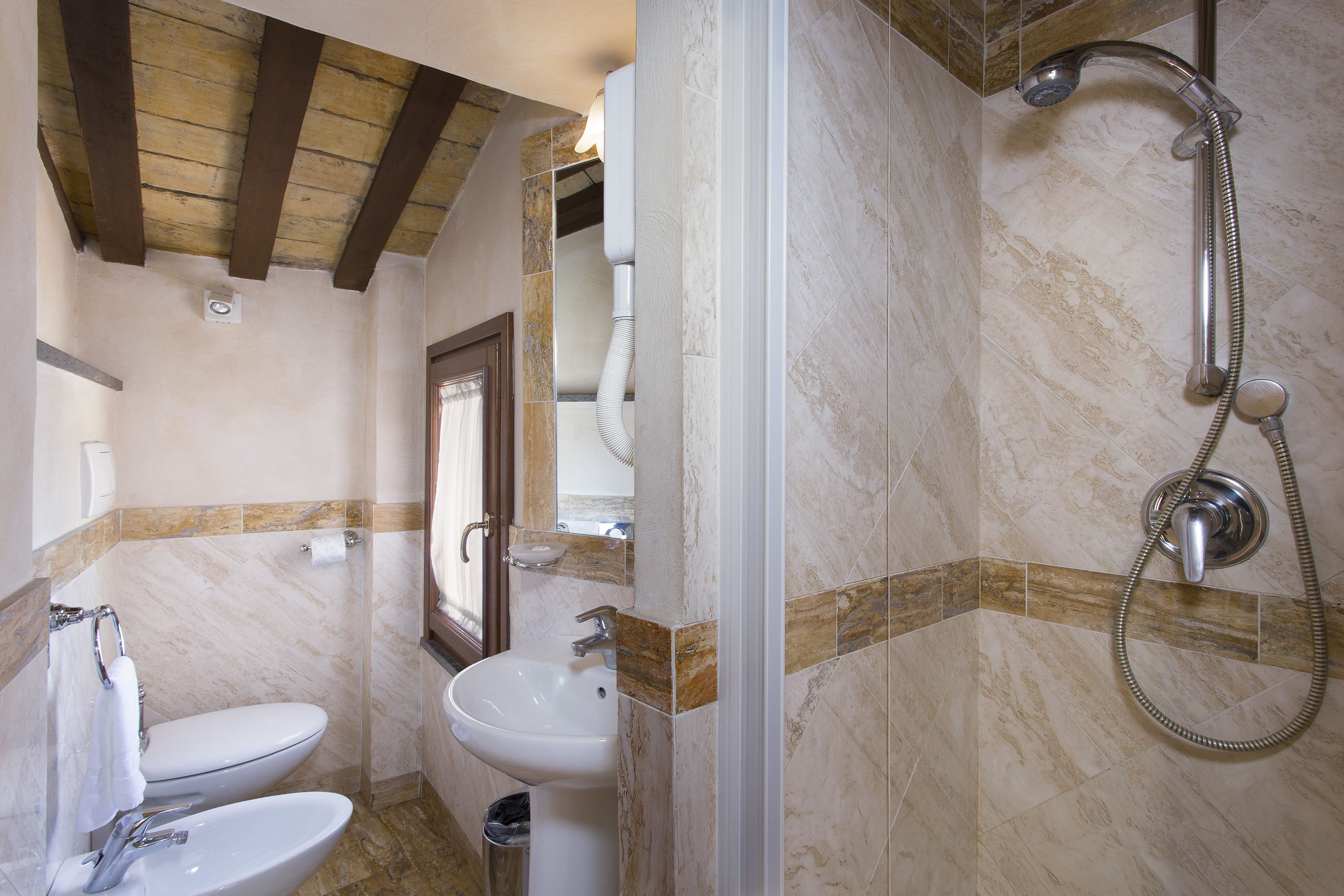 shower, hair dryer, bidet, towels