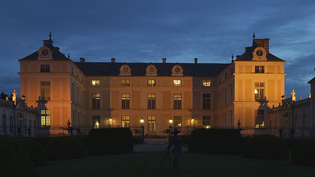 A large, historic building with symmetrical architecture, featuring multiple windows and a central entrance. - Chateau Colbert (Maulevrier)