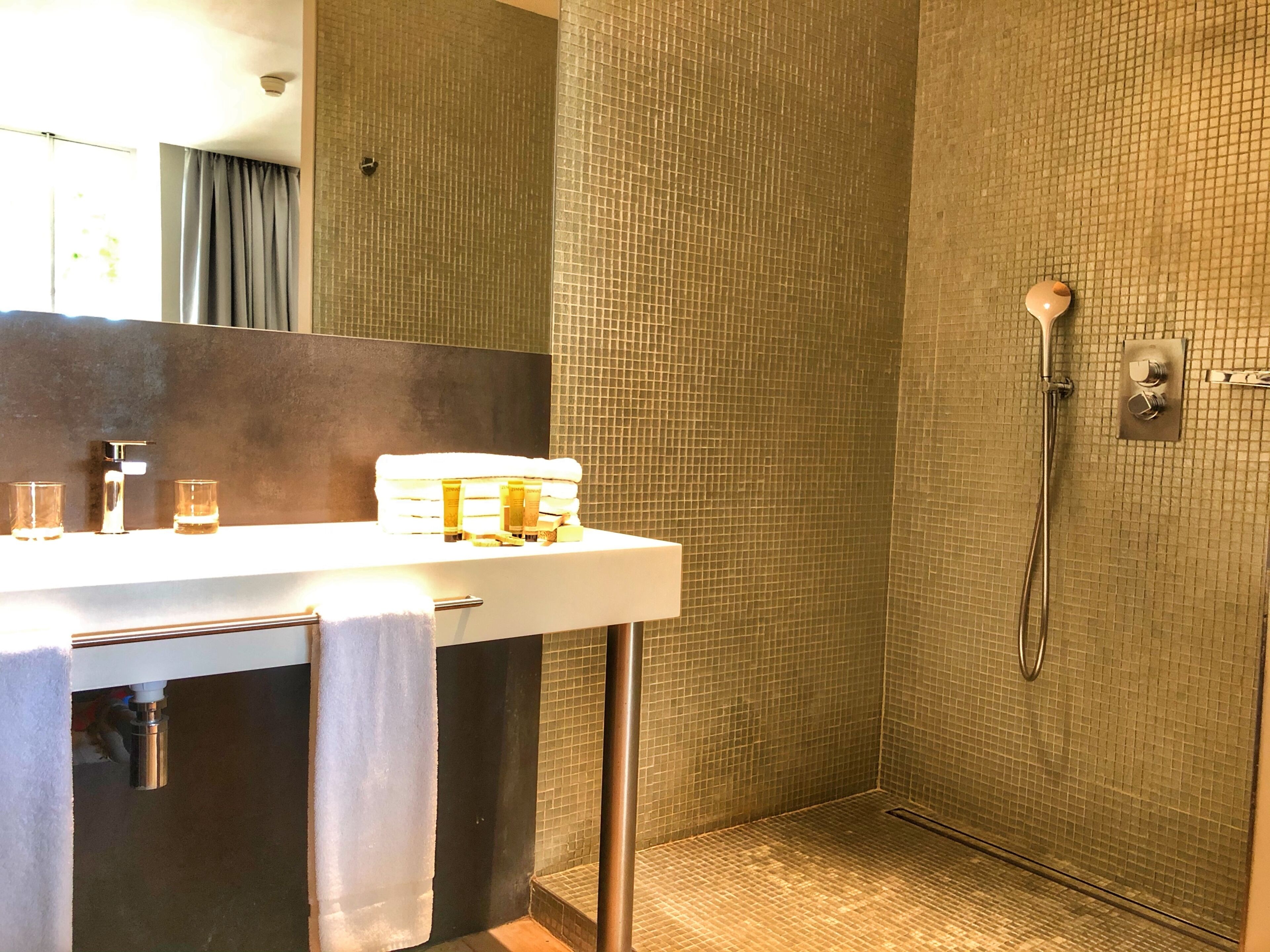 junior suite | bathroom | shower, rainfall showerhead, free toiletries, hair dryer