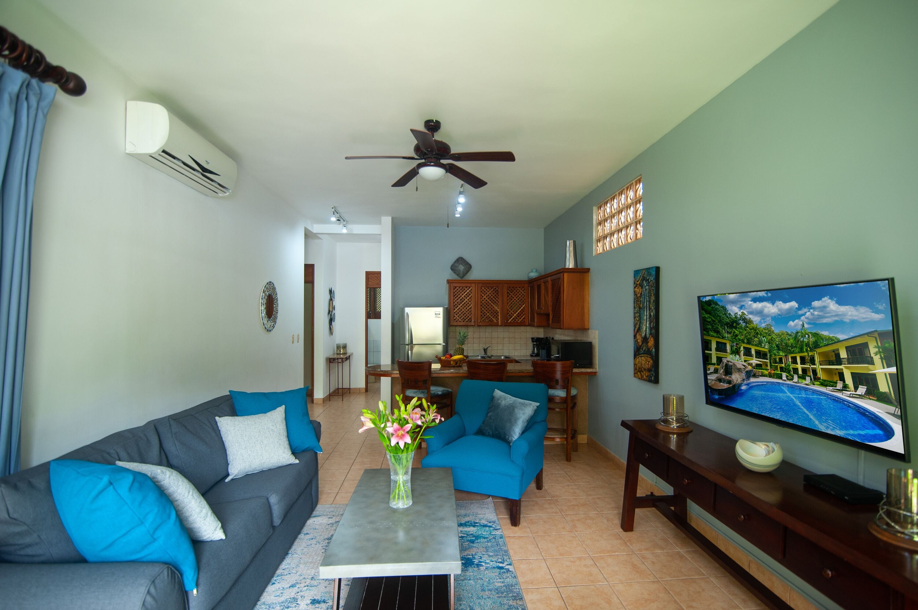 premium condo, 2 bedrooms, balcony, pool view | living area | 29-inch flat-screen tv with cable channels, tv, dvd player