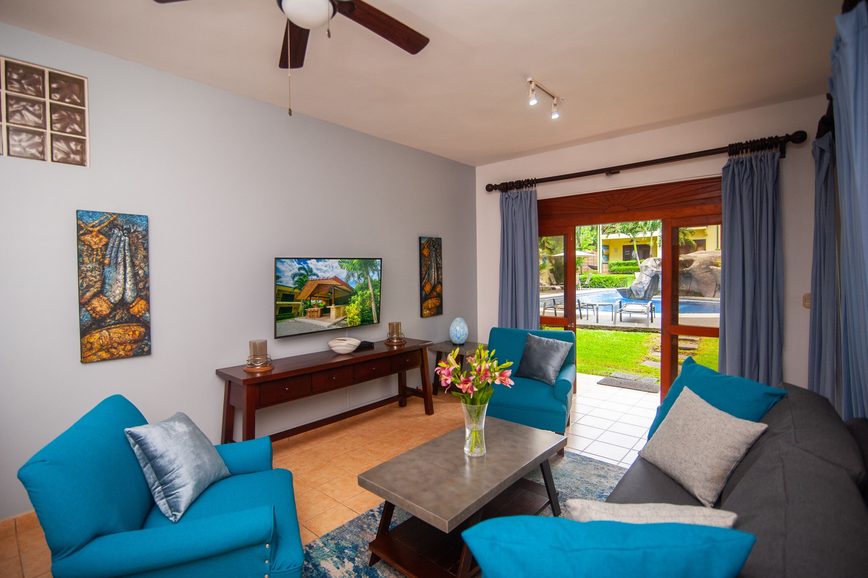 premium condo, 2 bedrooms, balcony, pool view | living area | 29-inch flat-screen tv with cable channels, tv, dvd player