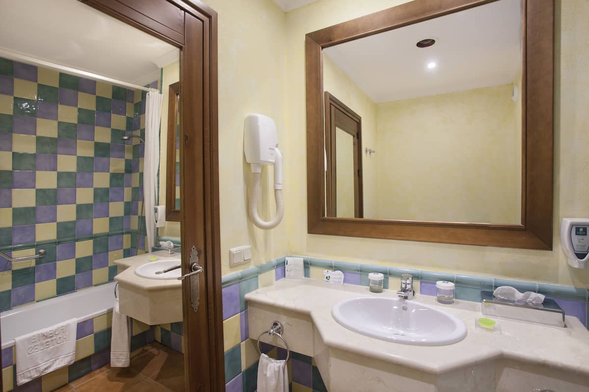 classic triple room, garden area | 1 bedroom, down duvets, minibar, in-room safe