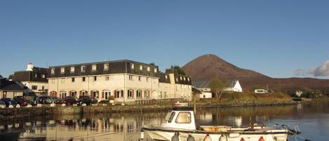 A building with a dock and a boat.