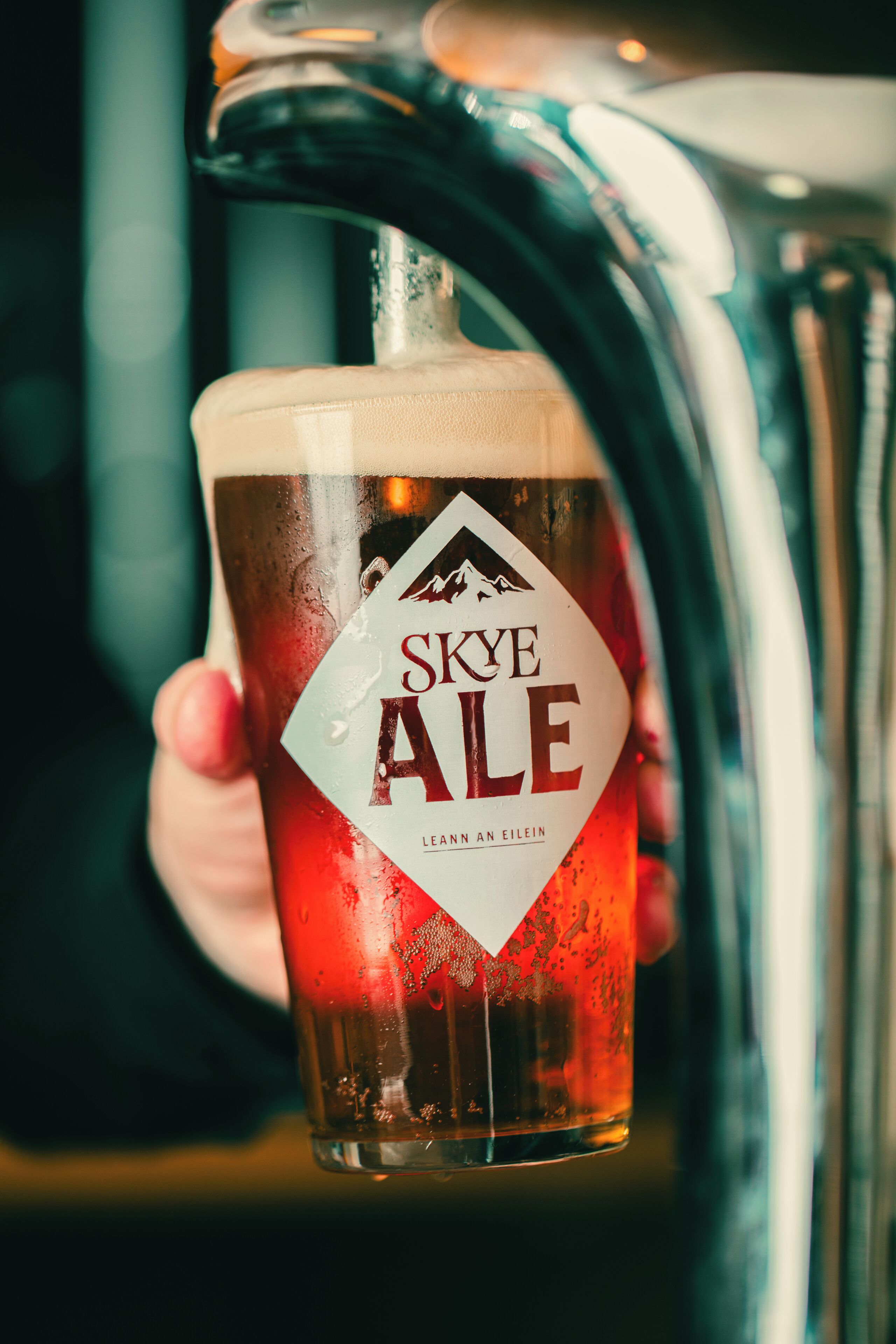 A glass of Skye Ale being filled from a tap.