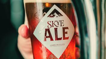 A glass of Skye Ale being filled from a tap.