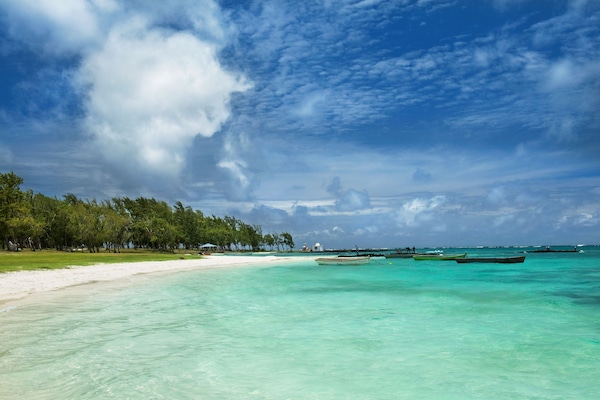 Beach nearby, white sand, sun loungers, beach umbrellas