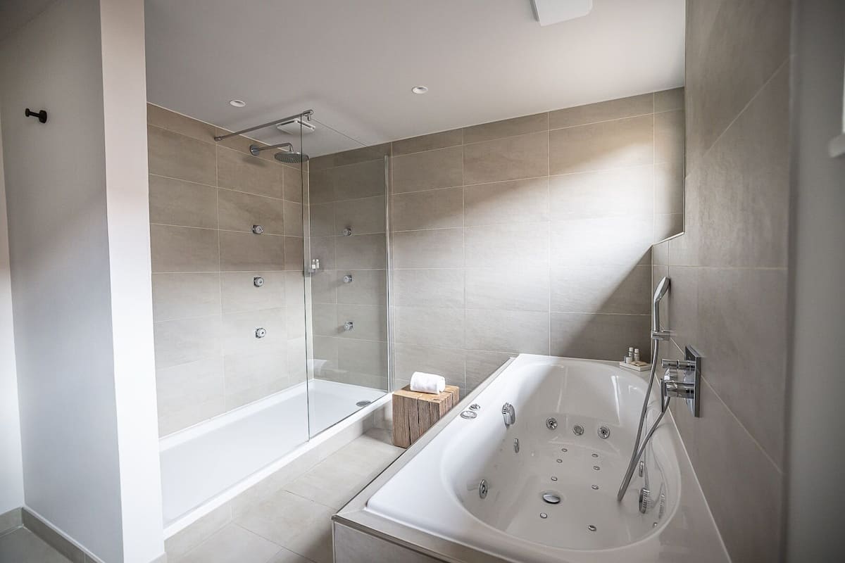suite | bathroom | deep-soaking bathtub, free toiletries, hair dryer, bathrobes