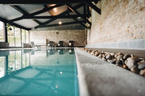 Indoor pool, open 8 AM to 10 PM, pool loungers
