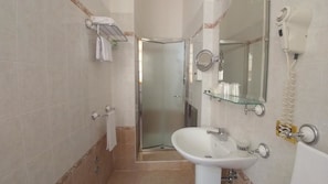 Shower, free toiletries, hair dryer, slippers