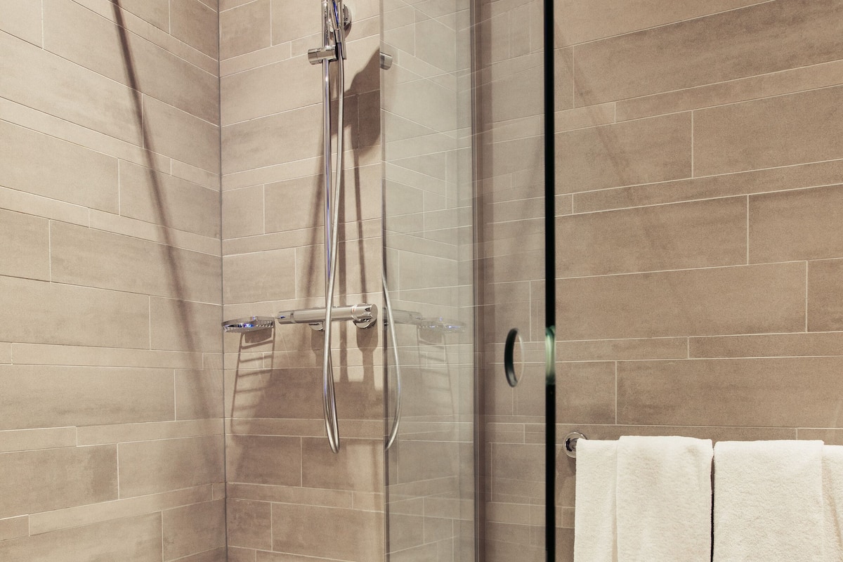 superior double or twin room, no windows (atlantis loft) | bathroom | combined shower/bathtub, rainfall showerhead, free toiletries