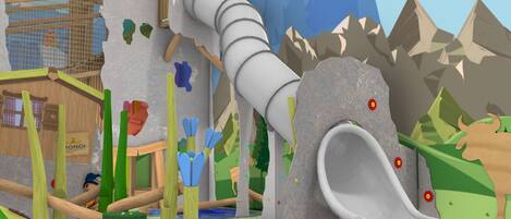 A playground with a slide, climbing structures, and a wooden house.