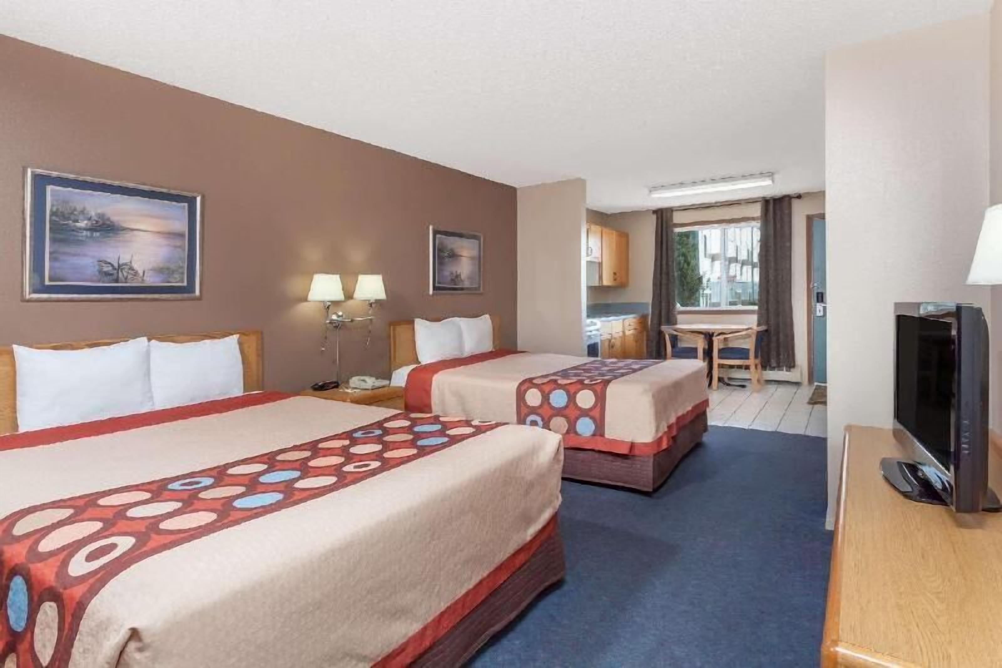 Desk, blackout drapes, iron/ironing board, free cribs/infant beds