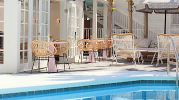 Outdoor pool, open 8:00 AM to 10:00 PM, sun loungers