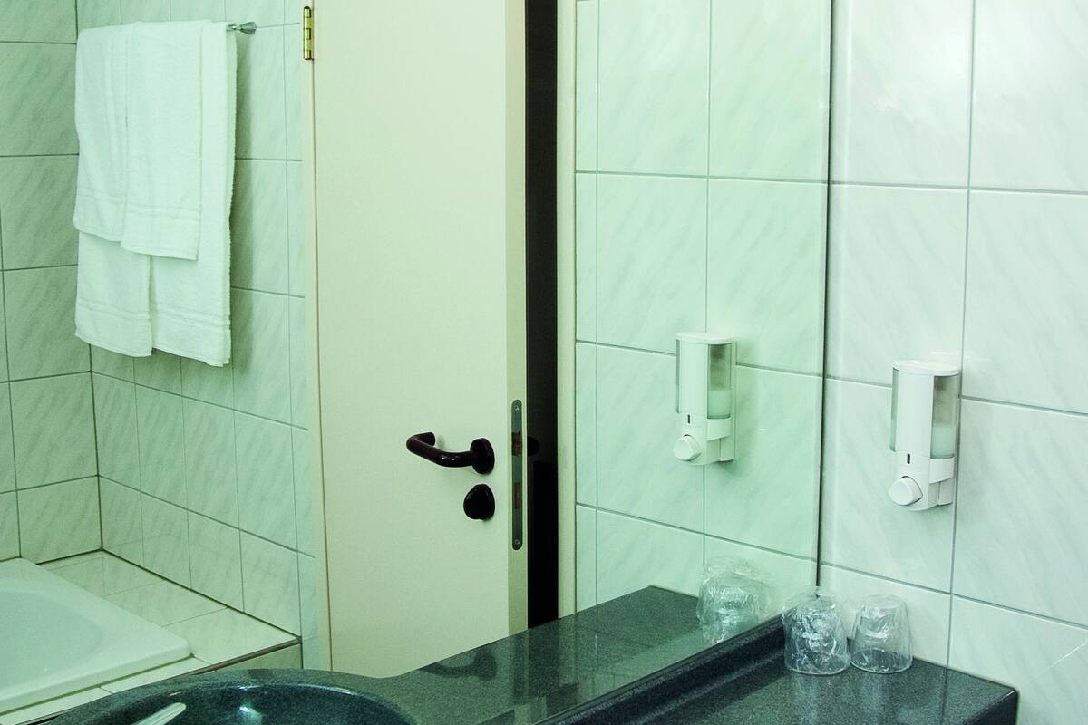 eco-friendly toiletries, hair dryer, towels