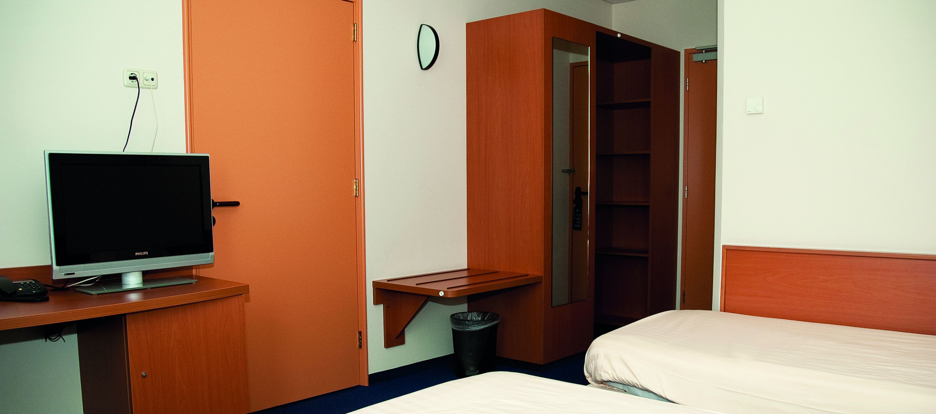 family room | in-room safe, desk, blackout curtains, iron/ironing board