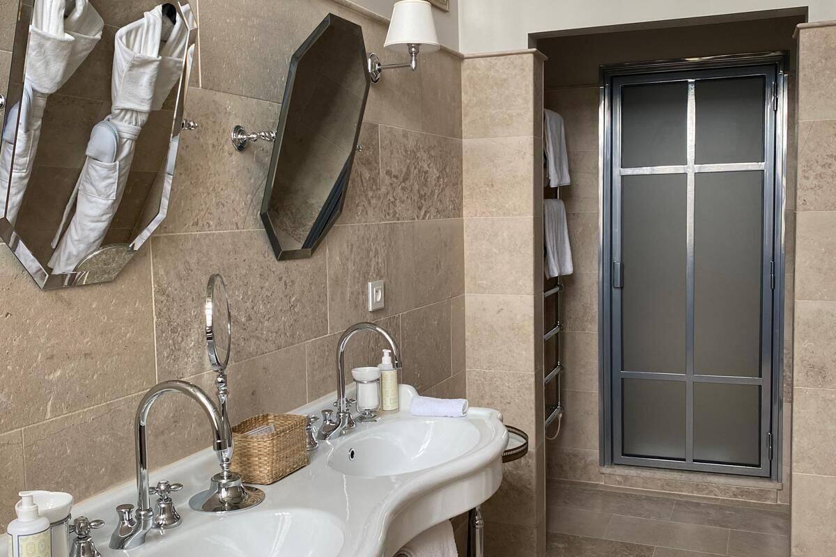 signature room | bathroom | free toiletries, hair dryer, bathrobes, slippers