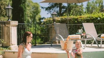Outdoor pool, open 8:00 AM to 8:00 PM, pool umbrellas, pool loungers
