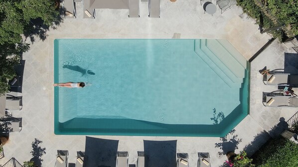 Outdoor pool, open 8:00 AM to 8:00 PM, pool umbrellas, pool loungers