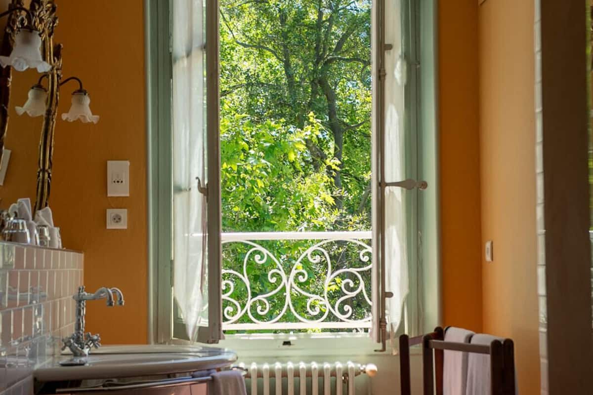 family room | bathroom amenities | bathtub, deep-soaking bathtub, designer toiletries, hair dryer