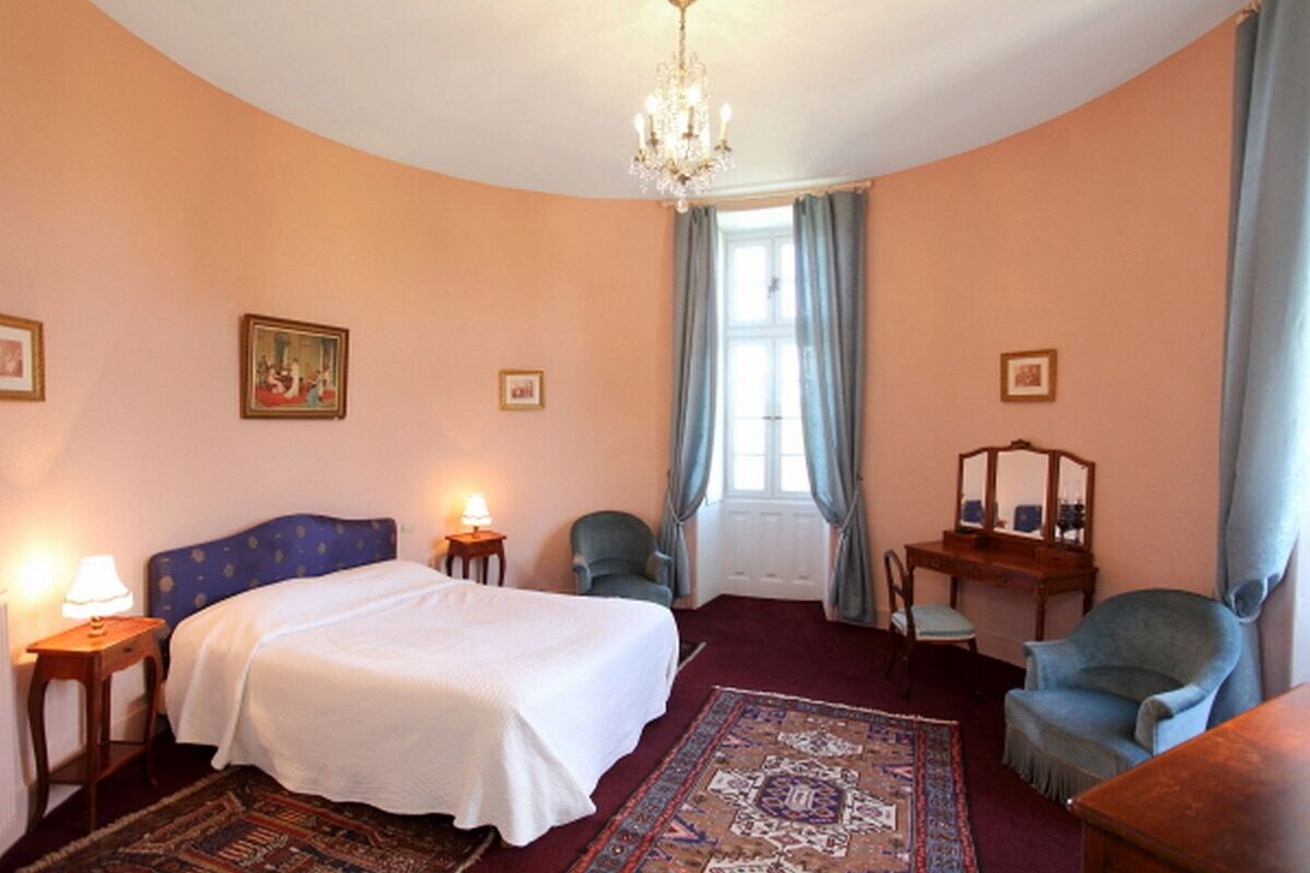 Premium bedding, desk, laptop workspace, blackout drapes