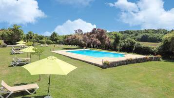Seasonal outdoor pool, open 8:00 AM to 8:00 PM, pool umbrellas