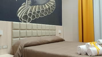 Down comforters, desk, blackout drapes, iron/ironing board