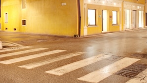 A yellow building with multiple windows and doors, likely a hotel or restaurant. - Due Mori (Marostica)