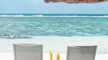 On the beach, white sand, free beach cabanas, sun-loungers