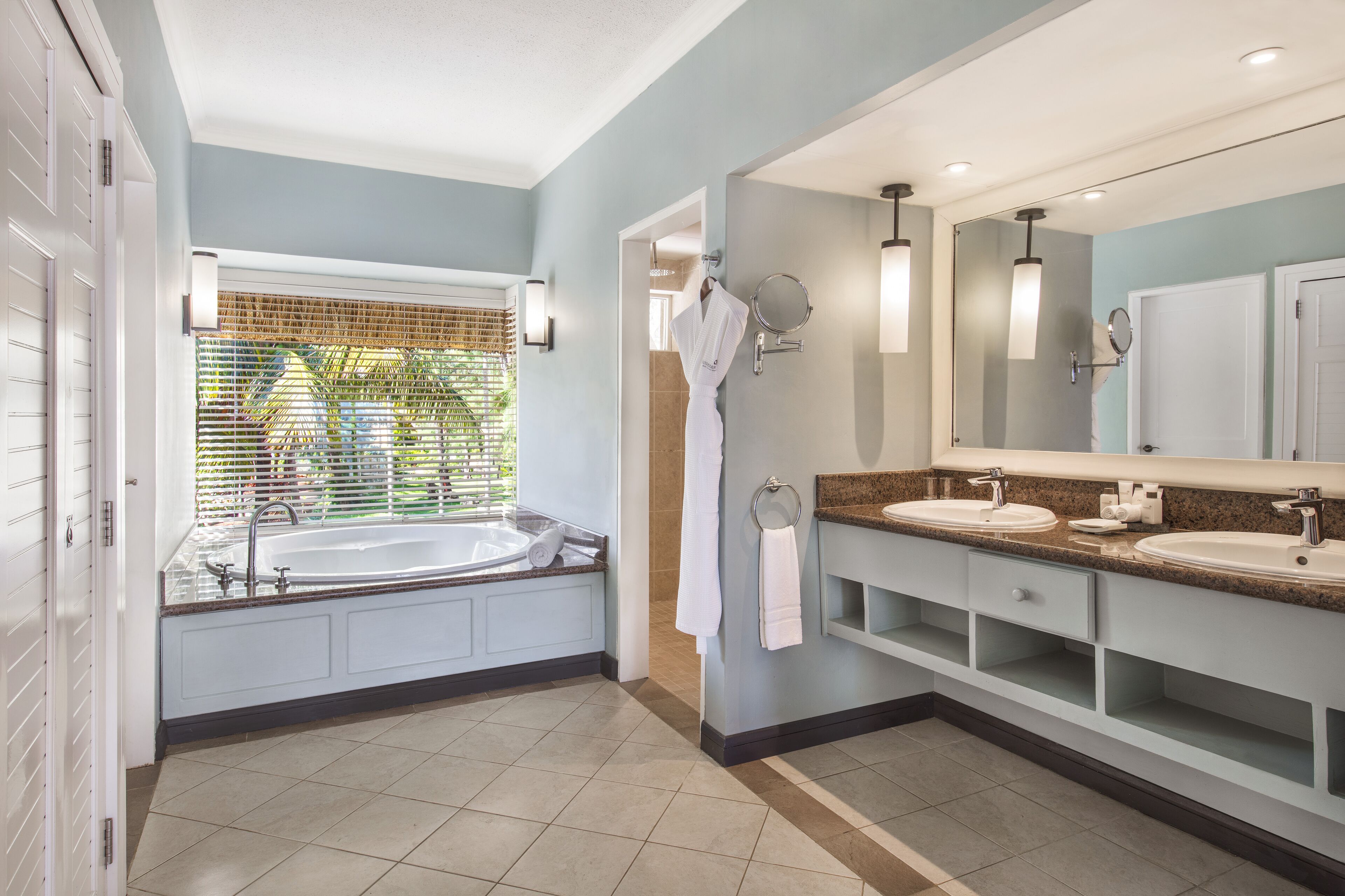 separate bathtub and shower, hair dryer, slippers, towels