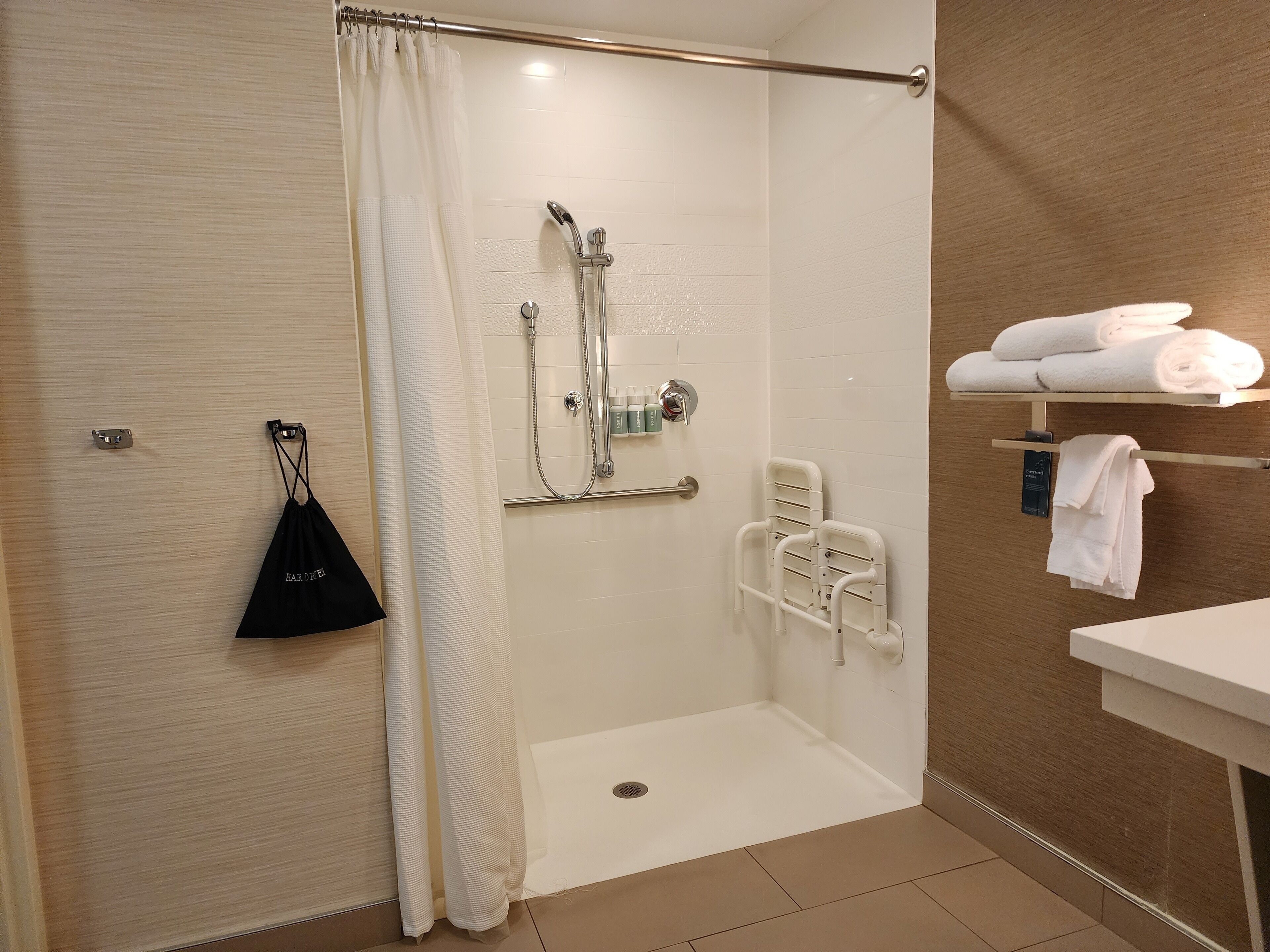 room, 1 king bed (mobility/hearing access, roll-in shwr) | bathroom | free toiletries, hair dryer, towels, soap