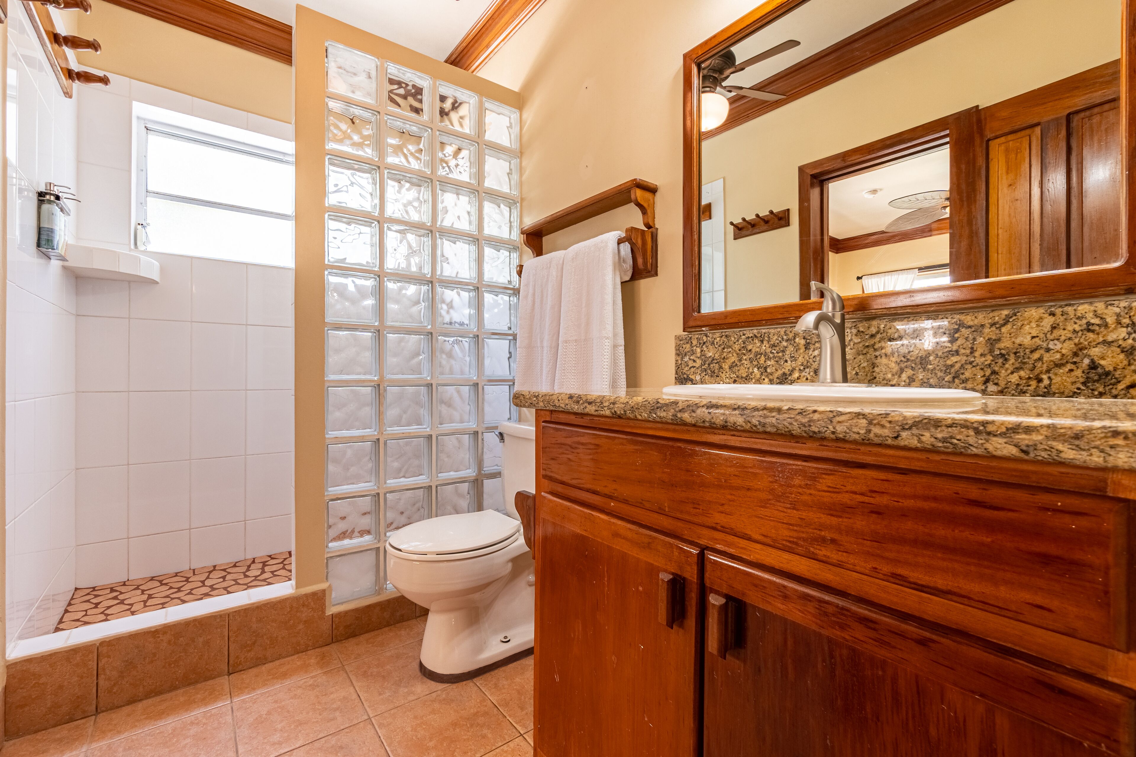 pool view lower level suite | bathroom | shower, free toiletries, hair dryer, towels