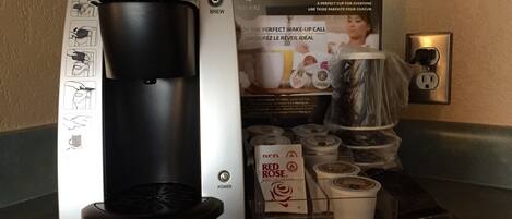 A Keurig coffee maker with a coffee pod holder and a Keurig coffee pod.